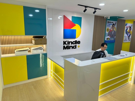 Learning centre reception with backlit counter and logo wall
