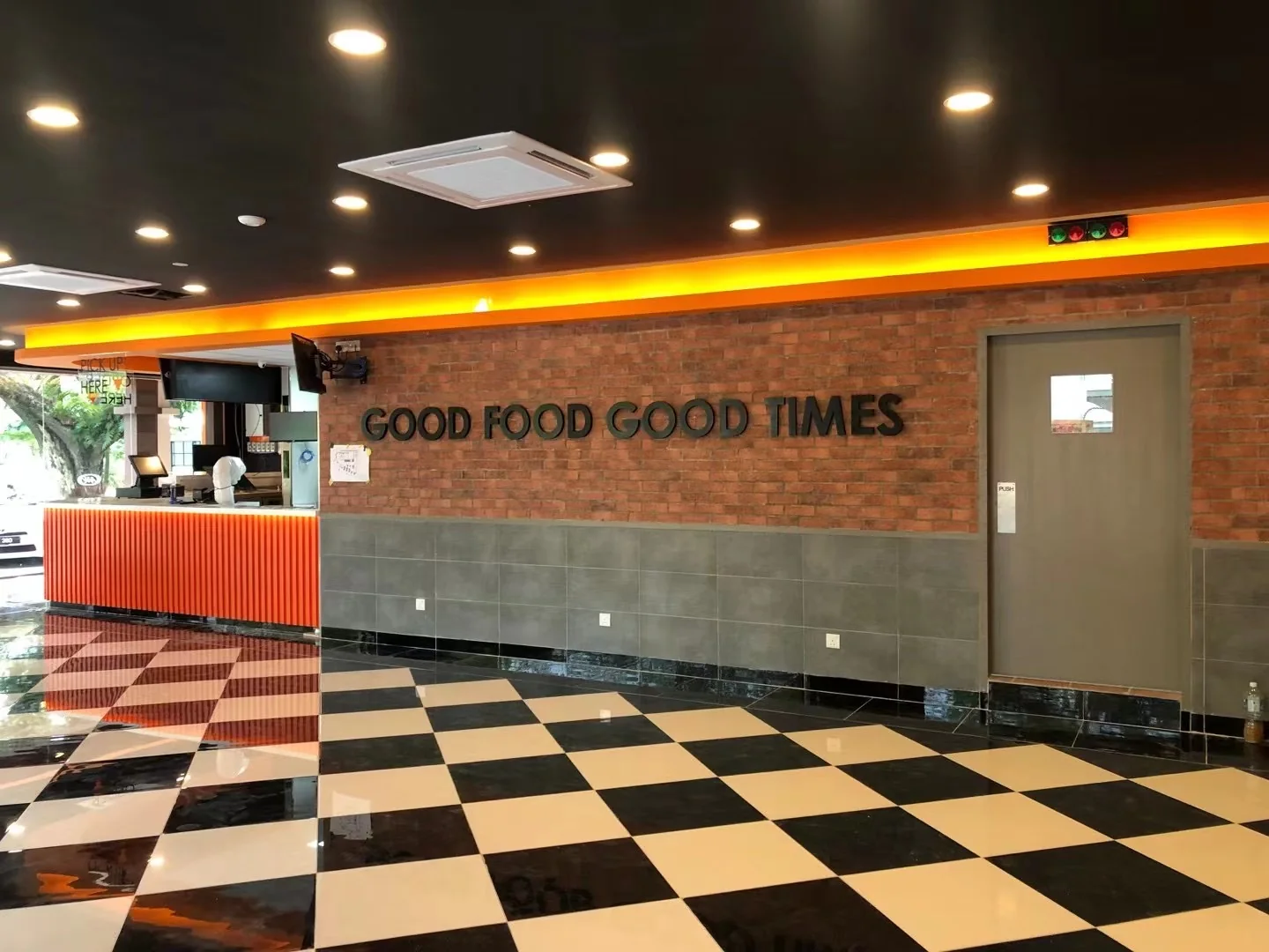 Completed restaurant interior with fitted dining area, service counter and coordinated lighting