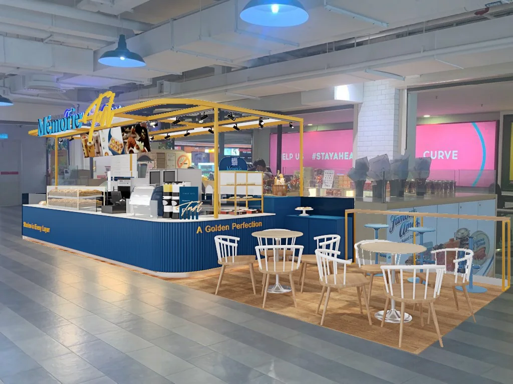 Completed mall kiosk with fitted counter, display lighting and nearby seating