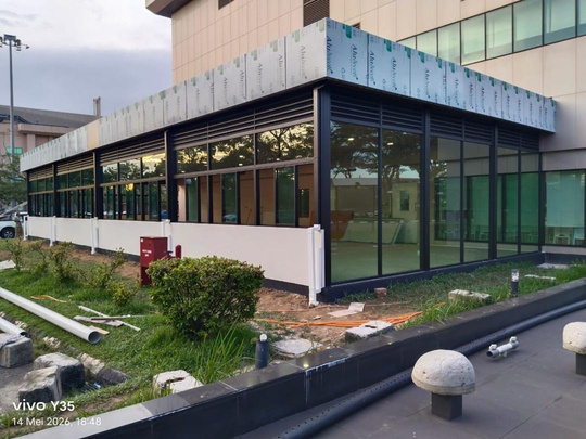 Completed commercial extension with a glazed exterior and covered entrance